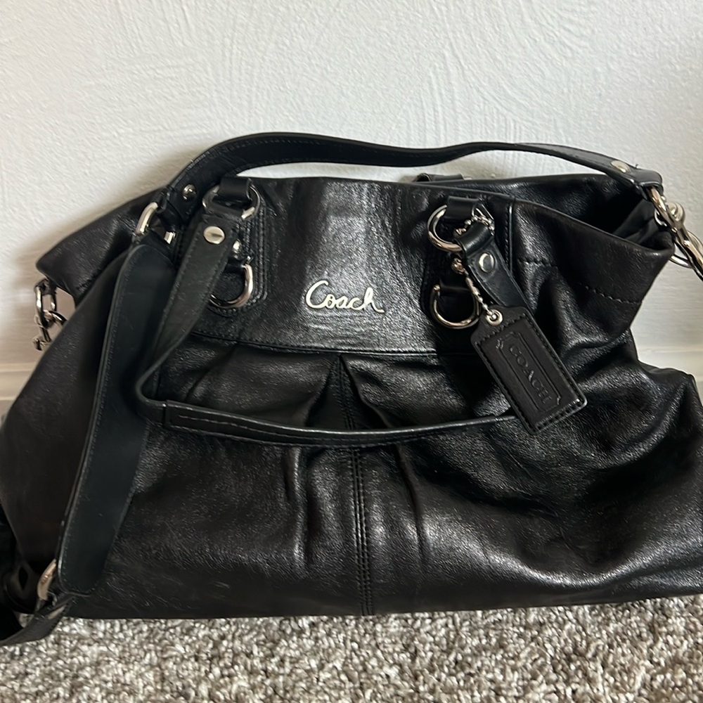 Coach purse with plum colored lining